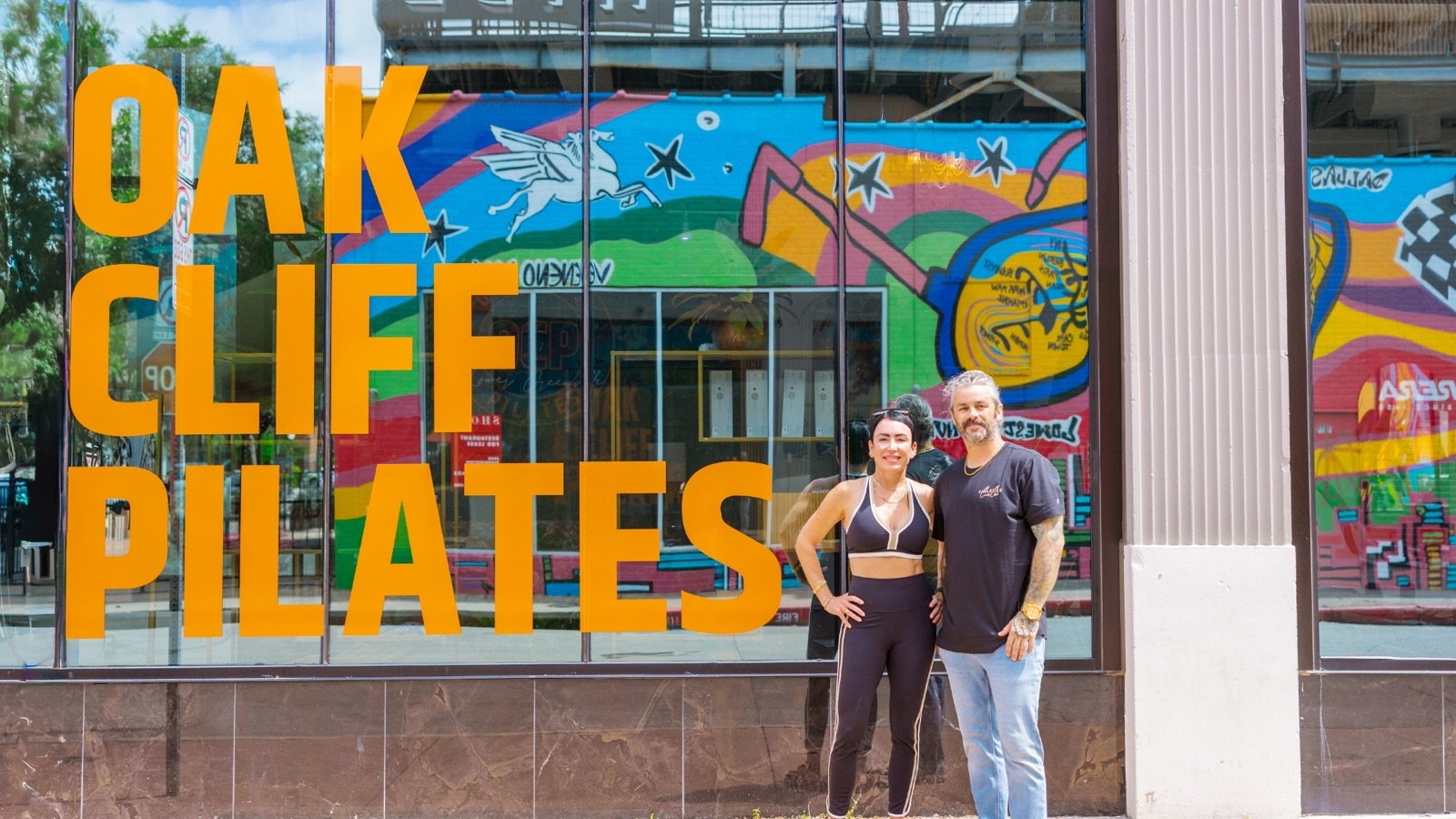 Amanda outside the Oak Cliff Pilates mural in Bishop Arts